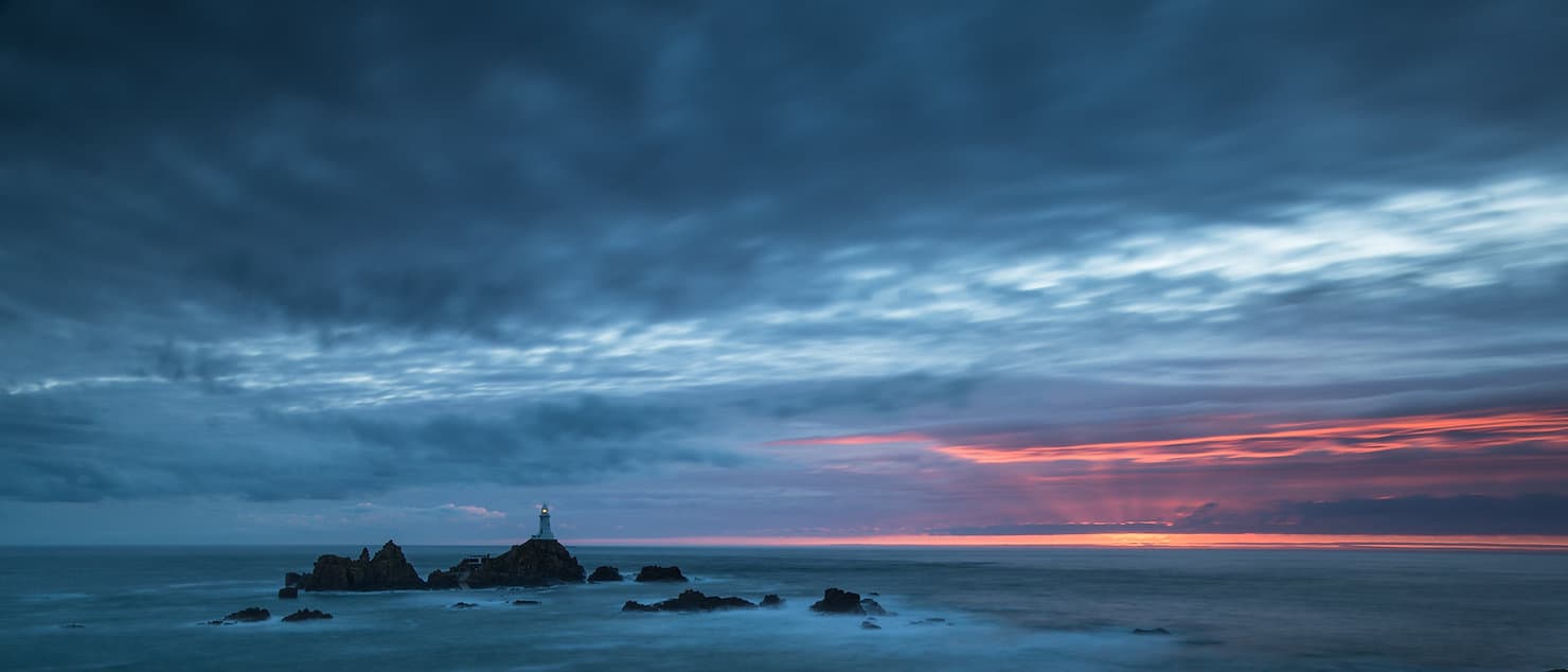 Photo of Corbière lighthouse at sunset.